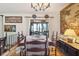 Dining room with hardwood floors, tapestry art, and a large window with natural light at 528 Wampler Dr, Charleston, SC 29412