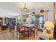 Open dining area featuring a table for six, hardwood floors, and access to the living area at 528 Wampler Dr, Charleston, SC 29412