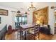 Charming dining area with a table set, hardwood floors, and scenic views through large windows at 528 Wampler Dr, Charleston, SC 29412