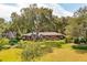 Beautifully landscaped brick home with lush lawn and mature trees at 528 Wampler Dr, Charleston, SC 29412