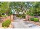 Private estate featuring brick entrance and mature trees on a long driveway at 528 Wampler Dr, Charleston, SC 29412