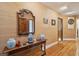Charming hallway featuring a decorative table with ornate mirror and hardwood floors, adding character to the space at 528 Wampler Dr, Charleston, SC 29412