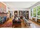 Spacious living room with classic décor, hardwood floors, and large windows for natural light, perfect for entertaining at 528 Wampler Dr, Charleston, SC 29412