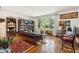 Bright living room with hardwood floors, large windows, and classic furnishings creating a cozy atmosphere at 528 Wampler Dr, Charleston, SC 29412