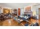 Cozy living room boasts a fireplace, hardwood floors, and vintage decor for a warm atmosphere at 528 Wampler Dr, Charleston, SC 29412