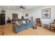 Cozy living room with a blue sofa, decorative pillows, and tiled floor at 528 Wampler Dr, Charleston, SC 29412