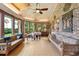 Inviting sunroom with exposed brick walls and large windows offering natural light at 528 Wampler Dr, Charleston, SC 29412