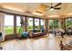 Spacious sunroom with tile flooring and views of the outside landscape at 528 Wampler Dr, Charleston, SC 29412