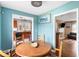 Bright dining area with wood table, fish artwork, and pass-through to the kitchen and living room at 532 Sunset Dr, Charleston, SC 29407
