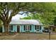 Charming home featuring a metal roof, updated windows, and a welcoming covered parking area at 532 Sunset Dr, Charleston, SC 29407