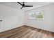 Bedroom features window and a modern ceiling fan above wood floors at 5774 Scott White Rd, Hollywood, SC 29449
