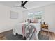 Stylishly decorated bedroom with a comfortable bed, accent pillows, modern ceiling fan, and a cozy rug, creating a relaxing retreat at 5774 Scott White Rd, Hollywood, SC 29449