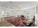 Inviting living room featuring ample natural light, hardwood floors, and stylish furnishings at 5774 Scott White Rd, Hollywood, SC 29449