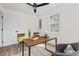 Bright office features windows, ceiling fan, and wood floors at 5774 Scott White Rd, Hollywood, SC 29449