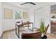 Bright office features windows, ceiling fan, and wood floors at 5774 Scott White Rd, Hollywood, SC 29449