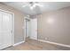 Neutral bedroom with hardwood floors featuring two entry doors and a closet at 6240 Old Point Rd # C-8, Hanahan, SC 29410