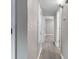 Bright hallway with hardwood floors and multiple doorways leading to other rooms in the home at 6240 Old Point Rd # C-8, Hanahan, SC 29410
