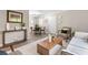 Open-concept living room and dining area, showcasing modern furniture, stylish decor, and ample natural light at 6240 Old Point Rd # C-8, Hanahan, SC 29410