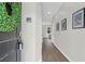 Entryway hallway with elegant wood floors, fresh paint and contemporary decor at 725 Pepperbush St, Charleston, SC 29414