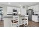 Elegant kitchen with white cabinetry, granite countertops, and stainless-steel appliances at 725 Pepperbush St, Charleston, SC 29414