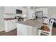 Modern kitchen featuring granite countertops, stainless steel appliances and a large island with seating at 725 Pepperbush St, Charleston, SC 29414