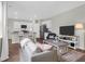Open-concept living room featuring a view of the modern kitchen and casual dining area at 725 Pepperbush St, Charleston, SC 29414