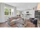 Bright and airy living room open to the kitchen with a large window at 725 Pepperbush St, Charleston, SC 29414