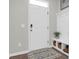 Welcoming mud room adjacent to front door with storage, a plant, and patterned rug at 725 Pepperbush St, Charleston, SC 29414