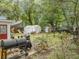 Spacious backyard featuring a large grill and storage sheds, perfect for outdoor gatherings at 759 Powhatan Ave, Mount Pleasant, SC 29464