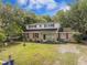 Inviting two-story home with a well-kept lawn and mature trees, offering a cozy atmosphere at 759 Powhatan Ave, Mount Pleasant, SC 29464