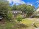 Two-story home with a beautiful lawn and mature trees, creating a serene and welcoming environment at 759 Powhatan Ave, Mount Pleasant, SC 29464