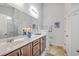 Spacious bathroom with double vanity, tile floors, a large mirror, and a separate toilet room at 7690 High Maple Cir, North Charleston, SC 29418