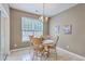 Inviting dining area with ample natural light and access to outdoor patio, perfect for Gathering gatherings at 7690 High Maple Cir, North Charleston, SC 29418