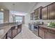 Stylish kitchen with updated appliances, granite countertops, and breakfast bar, ideal for casual dining at 7690 High Maple Cir, North Charleston, SC 29418