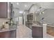 Modern kitchen with dark wood cabinets, granite countertops, and sleek appliances, perfect for culinary enthusiasts at 7690 High Maple Cir, North Charleston, SC 29418
