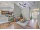 Cozy living room with vaulted ceilings, hardwood floors, and stylish decor, perfect for relaxation and entertaining at 7690 High Maple Cir, North Charleston, SC 29418