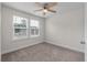 Cozy bedroom with natural light from the windows and neutral carpet, creating a peaceful atmosphere at 7780 Montview Rd, North Charleston, SC 29418