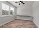 Bright bedroom with wood floors, ceiling fan, and large windows for natural light at 7780 Montview Rd, North Charleston, SC 29418