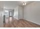 Dining room featuring wood floors and a view of the staircase and backyard at 7780 Montview Rd, North Charleston, SC 29418