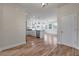 Open-concept layout with wood floors connecting the kitchen and living area, promoting a bright and airy space at 7780 Montview Rd, North Charleston, SC 29418