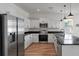 Modern kitchen with stainless steel appliances, white cabinets, and a functional center island at 7780 Montview Rd, North Charleston, SC 29418