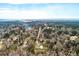 Overhead view shows property including house and metal building, with river in the distance at 8476 Old Georgetown Rd, McClellanville, SC 29458