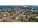 Aerial view of a wooded property featuring a house and metal building at 8476 Old Georgetown Rd, McClellanville, SC 29458