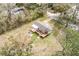 Aerial view of a home featuring a spacious deck, nestled in a natural setting at 8476 Old Georgetown Rd, McClellanville, SC 29458