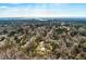 High aerial view of property with a home and metal building near ocean waterway at 8476 Old Georgetown Rd, McClellanville, SC 29458