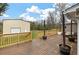 Expansive wooden back deck with wooden railings offers plenty of space for outdoor entertaining and overlooks detached shed at 8476 Old Georgetown Rd, McClellanville, SC 29458