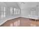 Bright bathroom featuring a claw foot tub with decorative windows and shutters at 8774 Adaline St, North Charleston, SC 29406