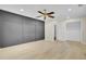 Spacious bedroom featuring modern trim work on accent wall, ceiling fan and a large closet at 8774 Adaline St, North Charleston, SC 29406