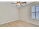 Well-lit bedroom with a ceiling fan and shuttered window for lots of natural light at 8774 Adaline St, North Charleston, SC 29406