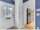 An entry foyer featuring a view of the kitchen with stainless steel appliances at 8774 Adaline St, North Charleston, SC 29406